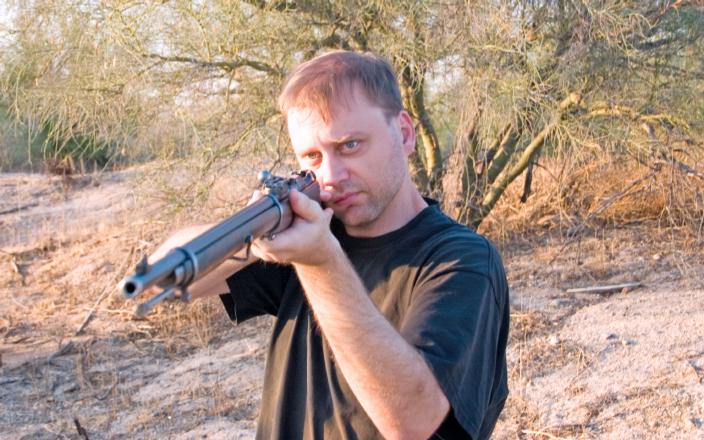 Image of the author's cousin posing with this rifle